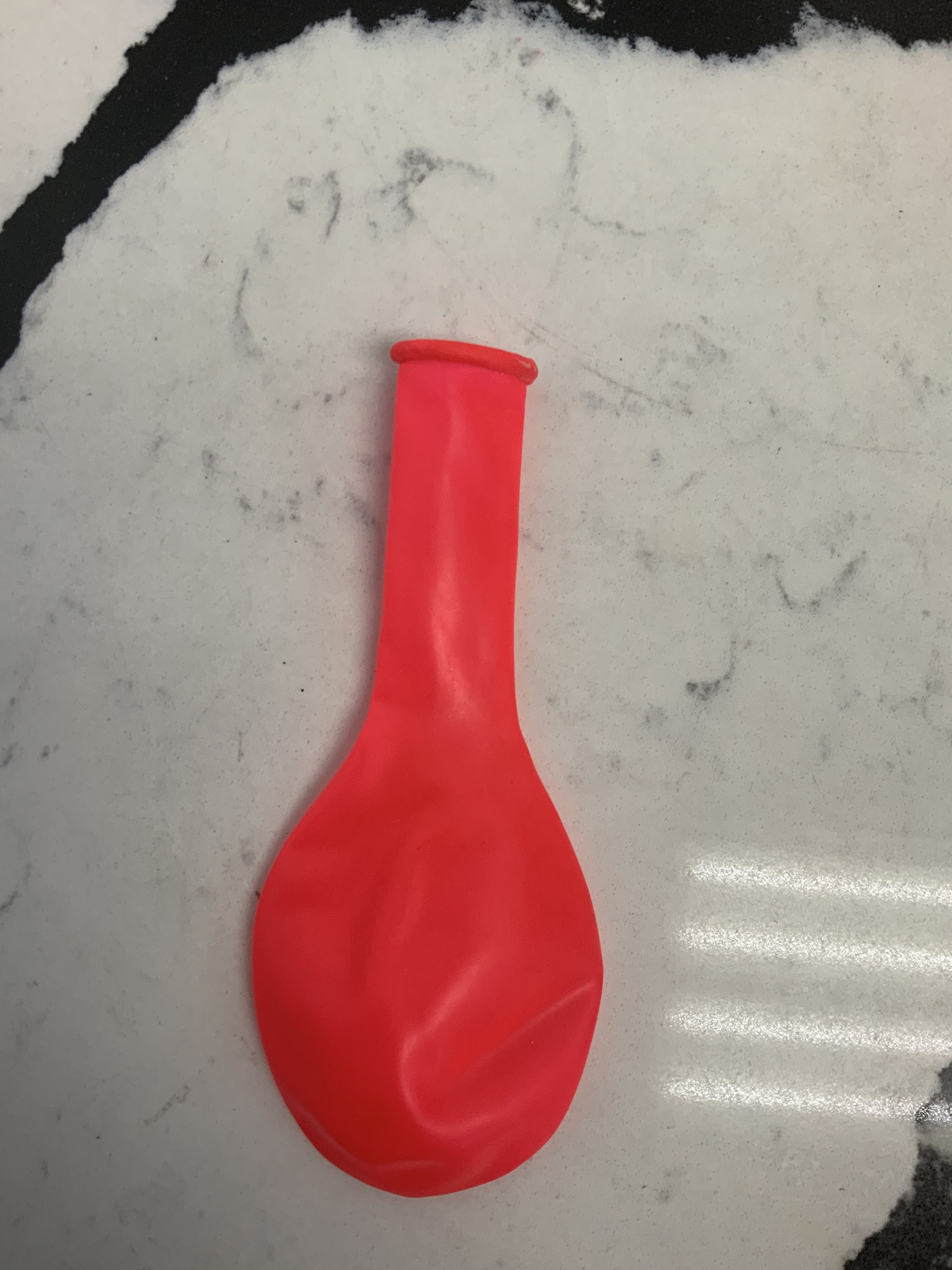 Neon pink latex balloon