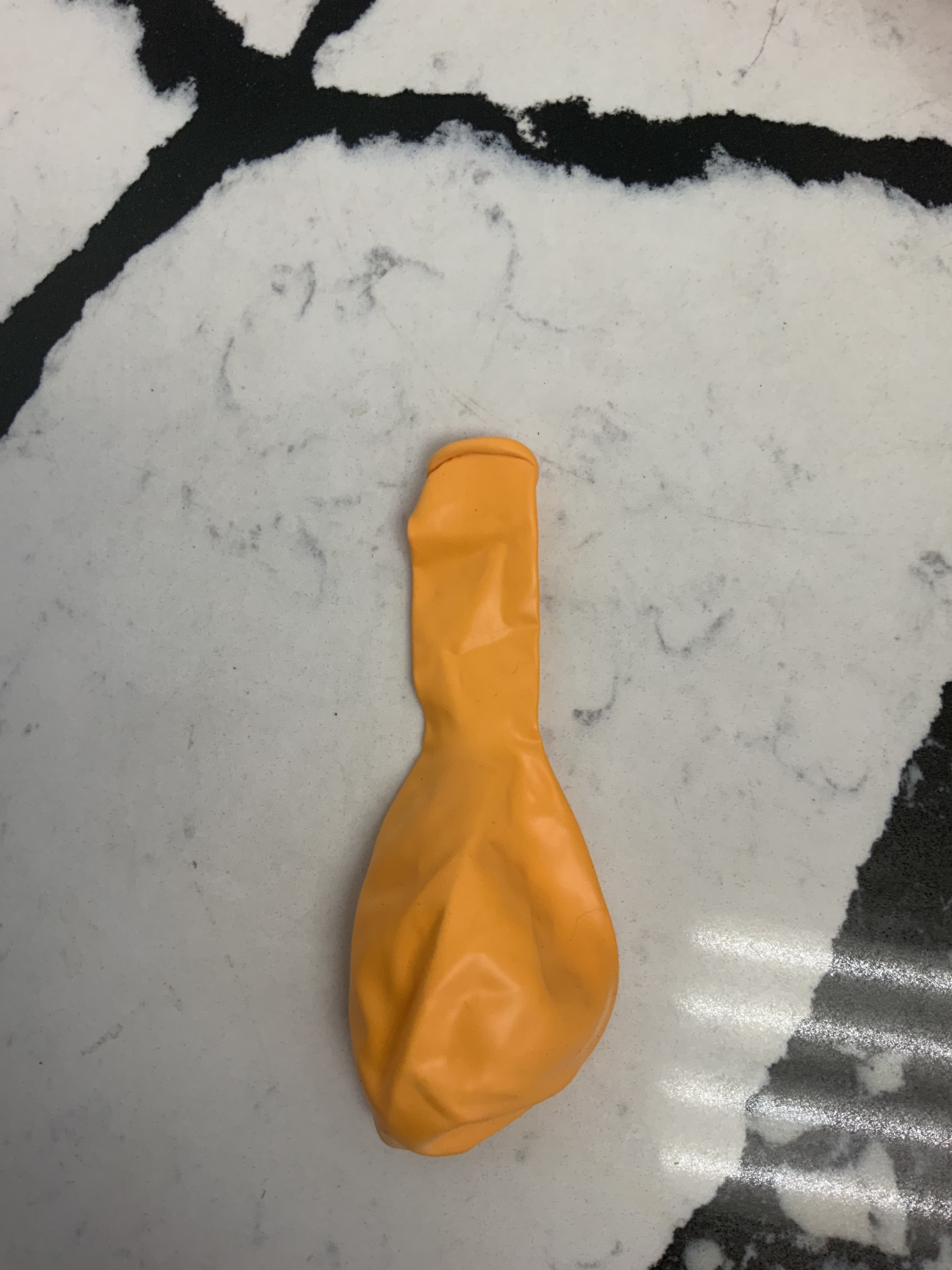 Orange latex balloon